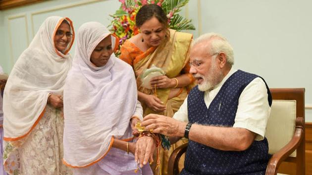 Women tie rakhis on the wrist of Prime Minister Narendra Modi on the occasion of Raksha Bandhan in New Delhi on Monday. (HT Photo) Women tie rakhis on the wrist of Prime Minister Narendra Modi on the occasion of Raksha Bandhan in New Delhi on Monday. (HT Photo)