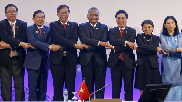 Vietnamese Foreign Minister Pham Binh Minh, third from right, and Shri V.K. Singh, center, India's minister of State for External Affairs, co-chairs of the ASEAN-India Ministerial Meeting of the 50th ASEAN Foreign Ministers' Meeting and Related Meetings, link arms with representatives of other ASEAN foreign ministers prior to the start of their meeting Sunday, Aug. 6, 2017 in Manila, Philippines. The annual forum, hosted by the Association of Southeast Asian Nations, brings together the top diplomats from 26 countries and the European Union for talks on political and security issues in Asia-Pacific. (AP) Vietnamese Foreign Minister Pham Binh Minh, third from right, and Shri V.K. Singh, center, India's minister of State for External Affairs, co-chairs of the ASEAN-India Ministerial Meeting of the 50th ASEAN Foreign Ministers' Meeting and Related Meetings, link arms with representatives of other ASEAN foreign ministers prior to the start of their meeting Sunday, Aug. 6, 2017 in Manila, Philippines. The annual forum, hosted by the Association of Southeast Asian Nations, brings together the top diplomats from 26 countries and the European Union for talks on political and security issues in Asia-Pacific. (AP)