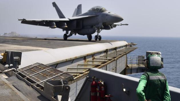 This US Navy photo obtained July 29, 2017 shows Airman Fausto Bautista standing a waist catapult watch aboard the aircraft carrier USS Nimitz (CVN 68)on July 26, 2017 in the Gulf. Nimitz is deployed to the US 5th Fleet area of operations in support of Operation Inherent Resolve. (AFP) This US Navy photo obtained July 29, 2017 shows Airman Fausto Bautista standing a waist catapult watch aboard the aircraft carrier USS Nimitz (CVN 68)on July 26, 2017 in the Gulf. Nimitz is deployed to the US 5th Fleet area of operations in support of Operation Inherent Resolve. (AFP)