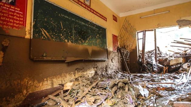 An elementary school classroom is filled with mud and debris after flash floods hit the mountainous town of Mu Cang Chai. (AFP) An elementary school classroom is filled with mud and debris after flash floods hit the mountainous town of Mu Cang Chai. (AFP)