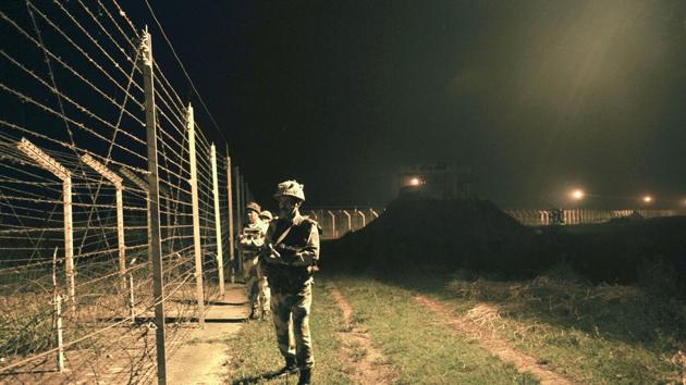 Border Security Force (BSF) soldiers standing guard during a night patrol near the fence at the India-Pakistan International Border at the outpost of Akhnoor sector. (HT FIle Photo) Border Security Force (BSF) soldiers standing guard during a night patrol near the fence at the India-Pakistan International Border at the outpost of Akhnoor sector. (HT FIle Photo)