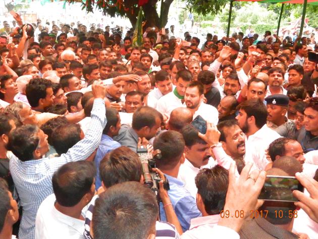 RJD leader Tejashwi Prasad Yadav (centre) with supporters at Gandhi memorial, Motihari, on Wednesday. (Madnakar/HT photo) RJD leader Tejashwi Prasad Yadav (centre) with supporters at Gandhi memorial, Motihari, on Wednesday. (Madnakar/HT photo)