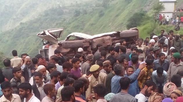 People gather near the site of the accident in Jamsalam village of Reasi, Jammu, on Wednesday. (Twitter) People gather near the site of the accident in Jamsalam village of Reasi, Jammu, on Wednesday. (Twitter)