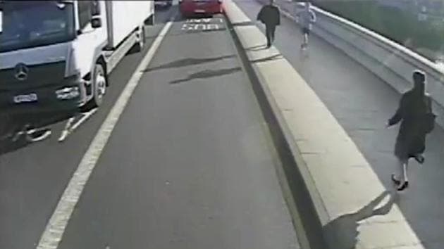 Surveillance camera video released by London's Metropolitan Police shows a male jogger (top right) running towards a woman, (bottom right), on Putney Bridge in London. (AP Photo) Surveillance camera video released by London's Metropolitan Police shows a male jogger (top right) running towards a woman, (bottom right), on Putney Bridge in London. (AP Photo)