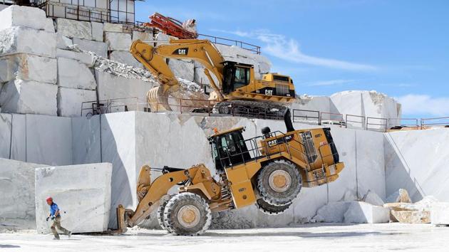 The primordial instruments such as levers, chisels and hammers later evolved into diamond-tipped wires, saws and heavy earth-moving equipment. Today the quarries of Altissimo are abuzz with the kind of activity that even a genius like Michelangelo probably could not have foreseen. (Alessandro Bianchi / REUTERS)