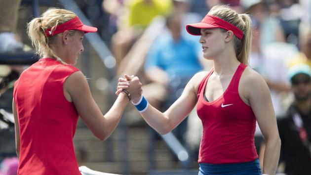 Canada’s Eugenie Bouchard shakes hands with Donna Vekic of Croatia following her defeat during their first round match at the Rogers Cup in Toronto on Tuesday. (AP) Canada’s Eugenie Bouchard shakes hands with Donna Vekic of Croatia following her defeat during their first round match at the Rogers Cup in Toronto on Tuesday. (AP)