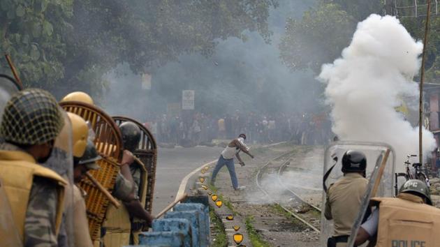 A supporter of a separate Gorkhaland state throwing a projectile at police during an indefinite strike at Sukna village in Darjeeling district on the outskirts of Siliguri on July 29. (AFP File Photo) A supporter of a separate Gorkhaland state throwing a projectile at police during an indefinite strike at Sukna village in Darjeeling district on the outskirts of Siliguri on July 29. (AFP File Photo)