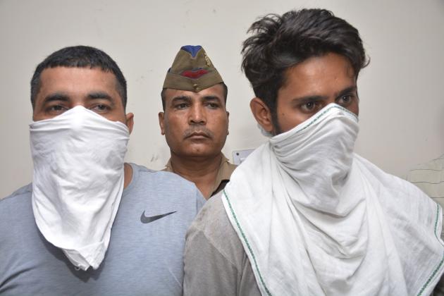 The builder and his accomplice after being arrested on Wednesday. (Sakib Ali/HT PHOTO) The builder and his accomplice after being arrested on Wednesday. (Sakib Ali/HT PHOTO)