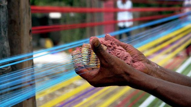 A worker prepares kite-thread in Jammu. Kite flying is a popular sport which sees a surge across the country in the days leading up to Independence Day. (PTI)