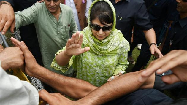 Jammu and Kashmir chief minister Mehbooba Mufti waves at supporters during the Peoples Democratic Party's 18th foundation day celebrations in Srinagar recently.(PTI)