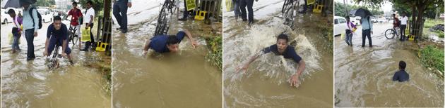 A cyclist fell into a pothole due to water logging near Altimis Hospital in Sector-52. (Sanjeev Verma/HT PHOTO) A cyclist fell into a pothole due to water logging near Altimis Hospital in Sector-52. (Sanjeev Verma/HT PHOTO)