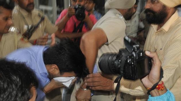 Vikas Barala, son of Haryana BJP chief Subhash Barala, being taken for medical test after he was arrested for stalking case, in Chandigarh on Wednesday.(Karun SharmaHT Photo)