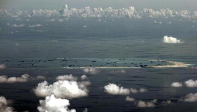 An aerial photo taken though a glass window of a Philippine military plane shows the alleged on-going land reclamation by China on Mischief Reef in the Spratly Islands in the South China Sea, west of Palawan, Philippines, May 11, 2015. (Reuters File Photo) An aerial photo taken though a glass window of a Philippine military plane shows the alleged on-going land reclamation by China on Mischief Reef in the Spratly Islands in the South China Sea, west of Palawan, Philippines, May 11, 2015. (Reuters File Photo)