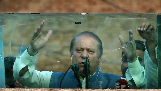 Deposed Pakistani Prime Minister Nawaz Sharif addresses his supporters behind glass during a rally in Jhelum, Pakistan, on August 10, 2017. (AP Photo) Deposed Pakistani Prime Minister Nawaz Sharif addresses his supporters behind glass during a rally in Jhelum, Pakistan, on August 10, 2017. (AP Photo)