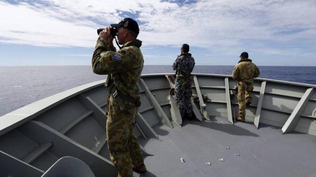 Crew members on the Australian Navy’s HMAS Perth scan the Indian Ocean for debris from Malaysia Airlines Flight MH370. (Reuters File Photo) Crew members on the Australian Navy’s HMAS Perth scan the Indian Ocean for debris from Malaysia Airlines Flight MH370. (Reuters File Photo)