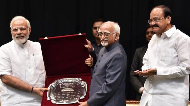Outgoing vice president Hamid Ansari being presented a memento by Prime Minister Narendra Modi as vice president-designate M Venkaiah Naidu looks on, during his farewell function at GMC Balayogi Auditorium at Parliament in New Delhi on Thursday. (PTI Photo) Outgoing vice president Hamid Ansari being presented a memento by Prime Minister Narendra Modi as vice president-designate M Venkaiah Naidu looks on, during his farewell function at GMC Balayogi Auditorium at Parliament in New Delhi on Thursday. (PTI Photo)