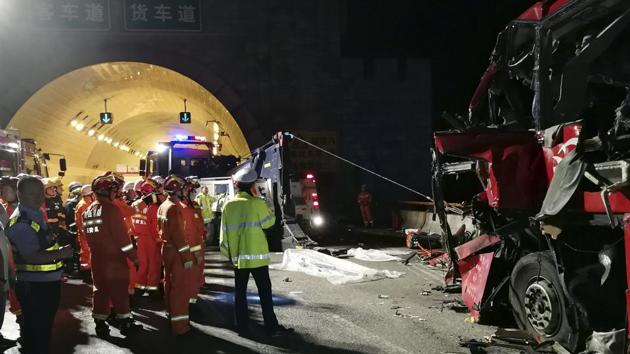 In this photo released by China's Xinhua News Agency, first responders work at the site of an accident after a coach hit the wall of the Qinling Mountains No. 1 Tunnel on the Jingkun Expressway in Ningshan County, northwestern China's Shaanxi Province, Friday, Aug. 11, 2017. (AP Photo) In this photo released by China's Xinhua News Agency, first responders work at the site of an accident after a coach hit the wall of the Qinling Mountains No. 1 Tunnel on the Jingkun Expressway in Ningshan County, northwestern China's Shaanxi Province, Friday, Aug. 11, 2017. (AP Photo)