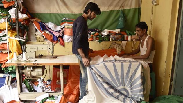 Several families in Old Delhi’s wholesale market area of Sadar Bazar have been engaged in making the national flag for decades. The months leading up to period around August 15 are especially busy as orders start pouring in from all parts of the country. (Burhaan Kinu / HT Photo)