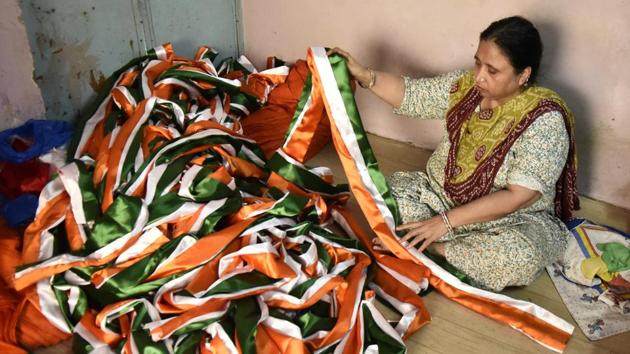 According to the flag makers in these workshops orders this year are more elaborate in their specifications compared to previous occasions. There has been a rise in demand for larger flags, ranging in the 20-30 ft range this year, many of which are headed to the border areas. (Burhaan Kinu / HT Photo)