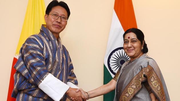 Foreign minister Sushma Swaraj (R) shakes hands with Bhutanese counterpart Damcho Dorji ahead of a bilateral meeting in Kathmandu on August 11, 2017. (AFP Photo) Foreign minister Sushma Swaraj (R) shakes hands with Bhutanese counterpart Damcho Dorji ahead of a bilateral meeting in Kathmandu on August 11, 2017. (AFP Photo)