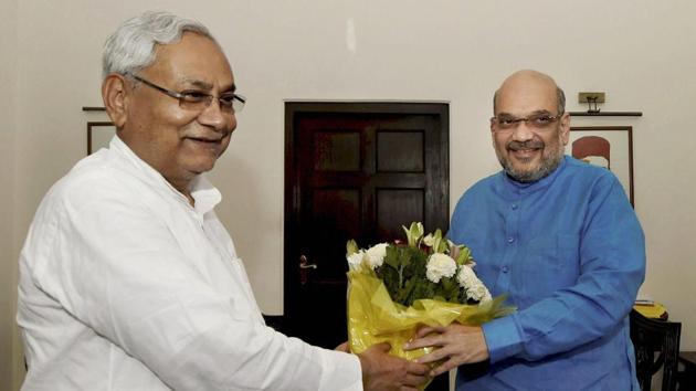 Bihar CM Nitish Kumar greets BJP president Amit Shah during a meeting in New Delhi. (PTI Photo) Bihar CM Nitish Kumar greets BJP president Amit Shah during a meeting in New Delhi. (PTI Photo)