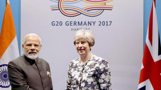 Prime Minister Narendra Modi with Britain PM Theresa May on the sidelines of the G-20 Summit in Hamburg, Germany, earlier this year.(PTI File Photo)