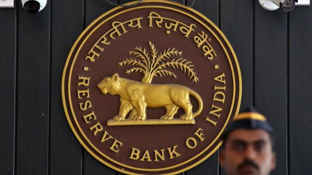 A security personnel member stands guard at the entrance of the Reserve Bank of India (RBI) headquarters in Mumbai. (REUTERS) A security personnel member stands guard at the entrance of the Reserve Bank of India (RBI) headquarters in Mumbai. (REUTERS)