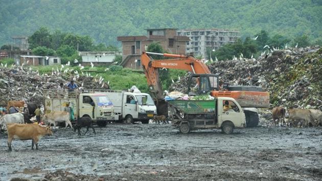 Shifting of waste operations from trenching ground on Sahastradhara Road to Shishambara on the city's outskirts is likely to be extended till December. (Vinay Santosh Kumar/HT Photo) Shifting of waste operations from trenching ground on Sahastradhara Road to Shishambara on the city's outskirts is likely to be extended till December. (Vinay Santosh Kumar/HT Photo)