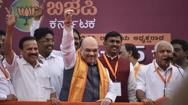 BJP president Amit Shah with Karnataka state chief BS Yeddyurappa and union minister Sadananda Gowda in Bengaluru. (HT Photo/Arijit Sen) BJP president Amit Shah with Karnataka state chief BS Yeddyurappa and union minister Sadananda Gowda in Bengaluru. (HT Photo/Arijit Sen)