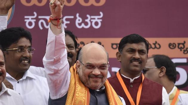 BJP president Amit Shah gestures to supporters in Bengaluru. (Arijit Sen/HT Photo) BJP president Amit Shah gestures to supporters in Bengaluru. (Arijit Sen/HT Photo)
