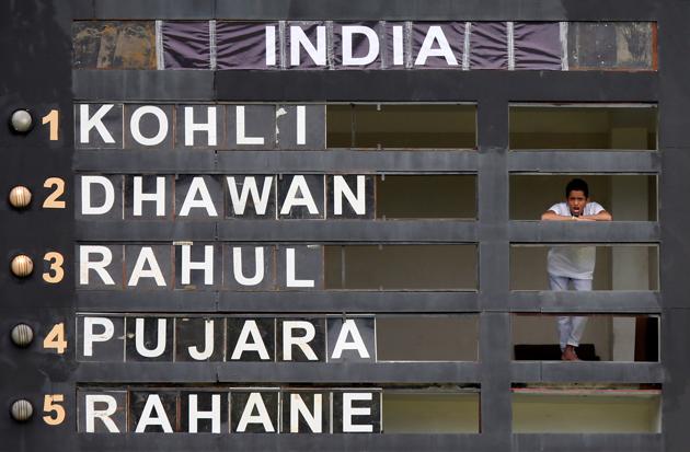 A man watches the match from inside the score board building in Pallekele. (REUTERS)