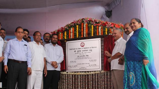 Union Minister of state for planning Rao Inderjit Singh (third from right) unveils the foundation stone of the rail electrification project at Gurgaon railway station on Saturday. (HT Photo) Union Minister of state for planning Rao Inderjit Singh (third from right) unveils the foundation stone of the rail electrification project at Gurgaon railway station on Saturday. (HT Photo)
