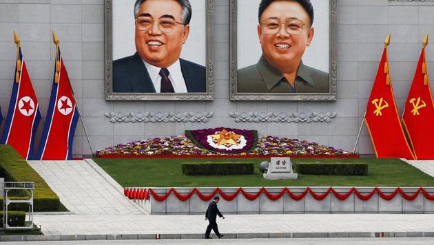 FILE PHOTO: A man walks in front of portraits of North Korea founder Kim Il Sung and late leader Kim Jong Il in central Pyongyang, North Korea April 16, 2017. (REUTERS)