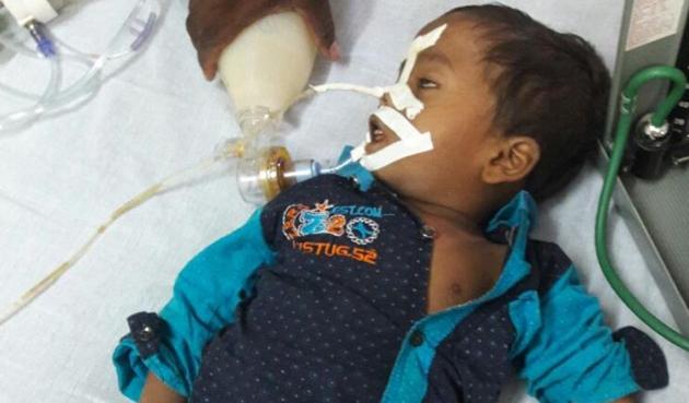 A child at the BRD Medical college in Gorakhpur where 30 children have died allegedly due to shortage of oxygen . (HT PHOTO) A child at the BRD Medical college in Gorakhpur where 30 children have died allegedly due to shortage of oxygen . (HT PHOTO)