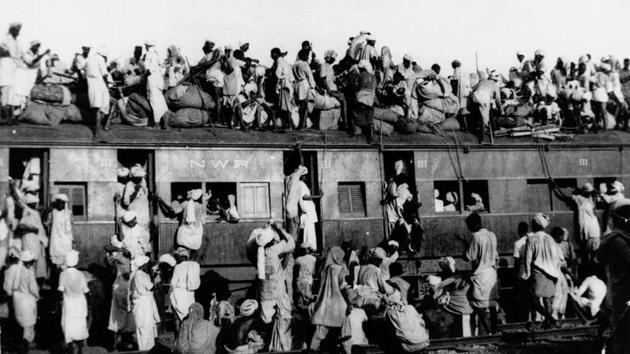 In this September 1947 photo hundreds of Muslim refugees crowd on top a train leaving New Delhi for Pakistan(AP)