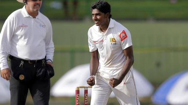 Sri Lanka's Lakshan Sandakan, right, celebrates the dismissal of India's captain Virat Kohli during the first day's play of their third Test match in Pallekele. (AP) Sri Lanka's Lakshan Sandakan, right, celebrates the dismissal of India's captain Virat Kohli during the first day's play of their third Test match in Pallekele. (AP)