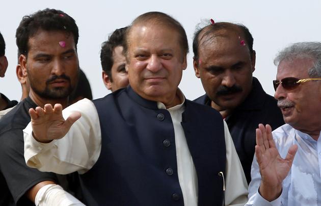 Nawaz Sharif waves to supporters during a rally in Muridke on August 12, 2017. (AP) Nawaz Sharif waves to supporters during a rally in Muridke on August 12, 2017. (AP)