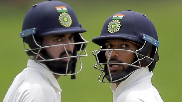 Pallekele : India's Shikhar Dhawan, right, and Lokesh Rahul run between the wickets. (AP)