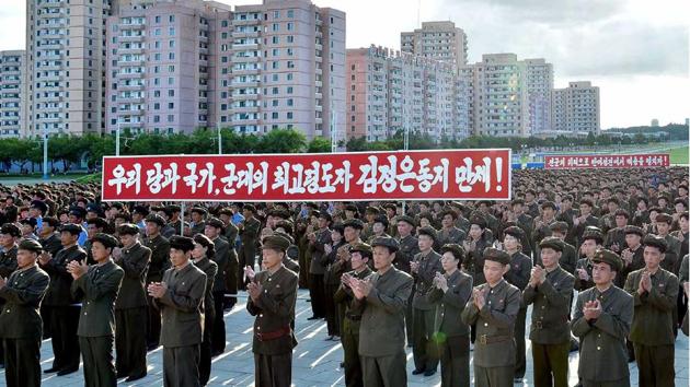North Korean youngsters, workers and trade union members hold a rally to protest the UN security council's sanctions resolution at the compound of the Monument to Party Founding in Pyongyang on Friday.(AFP)