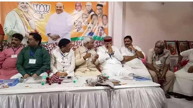 Urban development minister Madan Kaushik speaks with tourism minister Satpal Maharaj at a BJP meeting in Ranipur on Sunday. (Rameshwar Gaur/HT PHOTO) Urban development minister Madan Kaushik speaks with tourism minister Satpal Maharaj at a BJP meeting in Ranipur on Sunday. (Rameshwar Gaur/HT PHOTO)