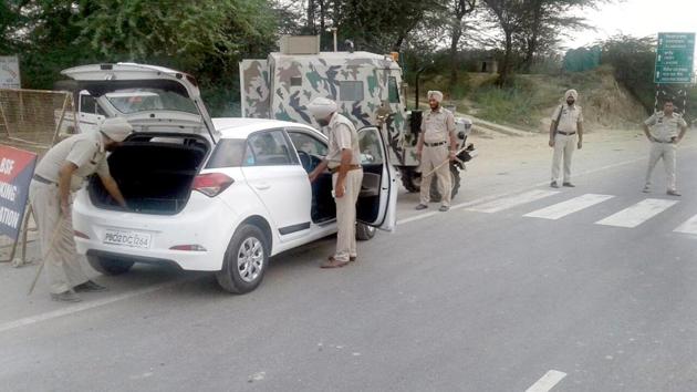 Police personnel checking a vehicle ahead of Independence Day near the Attari Border in Amritsar on Saturday. (HT Photo) Police personnel checking a vehicle ahead of Independence Day near the Attari Border in Amritsar on Saturday. (HT Photo)