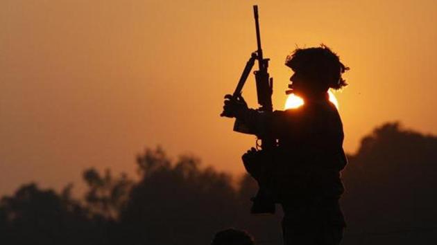 An Indian army soldie stands guard outside the air force base in Pathankot. (AP file) An Indian army soldie stands guard outside the air force base in Pathankot. (AP file)