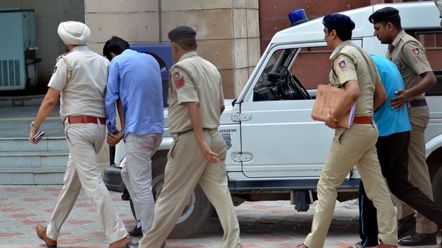 Vikas Brala and Ashish Kumar being produced at the Chandigarh court on Saturday. (Ravi Kumar/HT) Vikas Brala and Ashish Kumar being produced at the Chandigarh court on Saturday. (Ravi Kumar/HT)