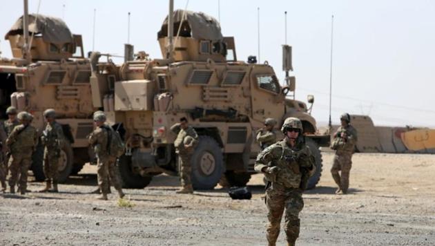 A US soldier runs at a coalition forces forward base near West Mosul, Iraq.(Reuters File Photo)