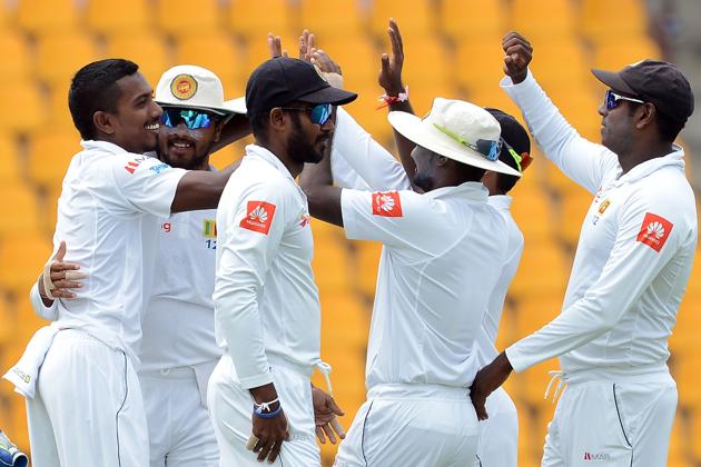 Sri Lanka's Vishwa Fernando (L) celebrates with his teammates after he dismissed India's Wriddhiman Saha. (AFP)