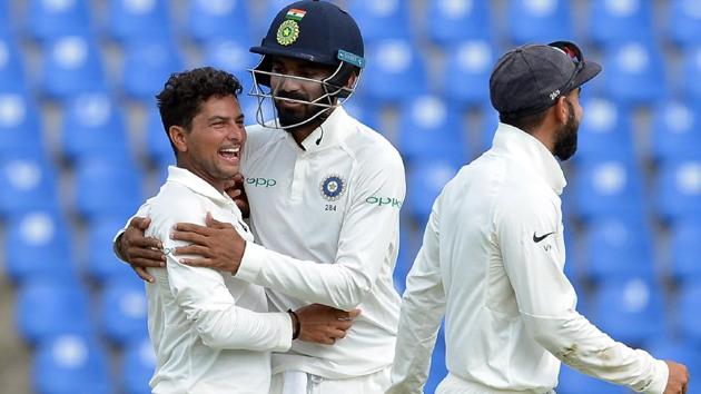Indian cricketer Kuldeep Yadav (L) celebrates with his teammates after he dismissed Sri Lankan cricketer Dilruwan Perera. (AFP)