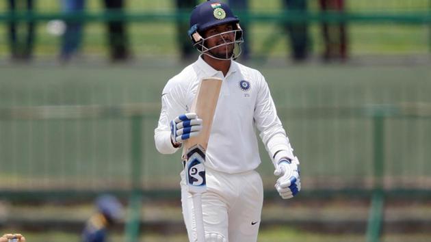 India's Umesh Yadav holds his broken bat after playing a shot. (REUTERS)