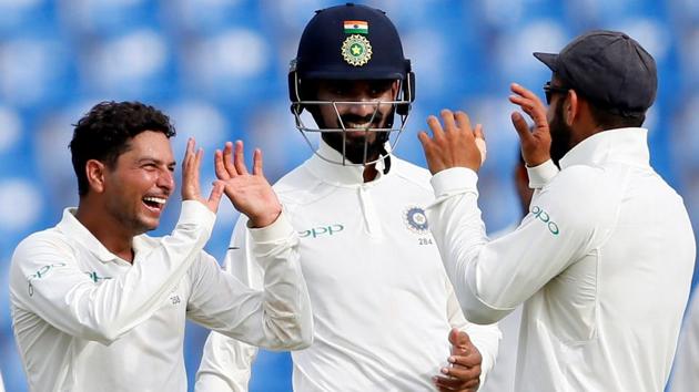 India's Kuldeep Yadav celebrates with captain Virat Kohli and Lokesh Rahul after taking the wicket of Sri Lanka's Vishwa Fernando. (REUTERS) India's Kuldeep Yadav celebrates with captain Virat Kohli and Lokesh Rahul after taking the wicket of Sri Lanka's Vishwa Fernando. (REUTERS)