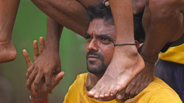 Members test their strength during a practice session. (Pratik Chorge/HT) 