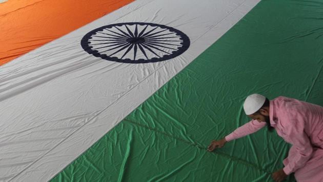 With Independence Day around the corner, workers in a flag factory in Bhiwandi give final touches to the tricolour on Thursday. (Praful Gangurde/HT Photo)